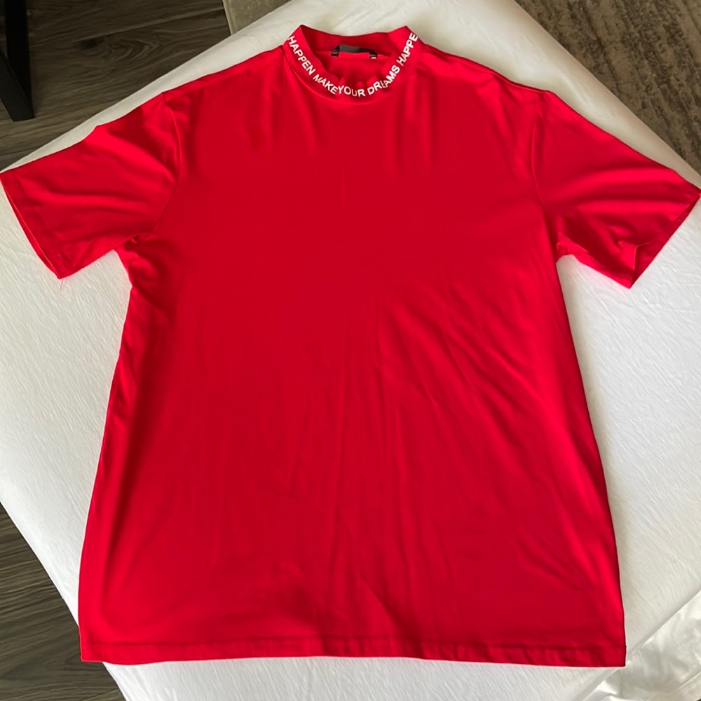 Red mens t shirt, size L, neck line says “make your dreams happen”